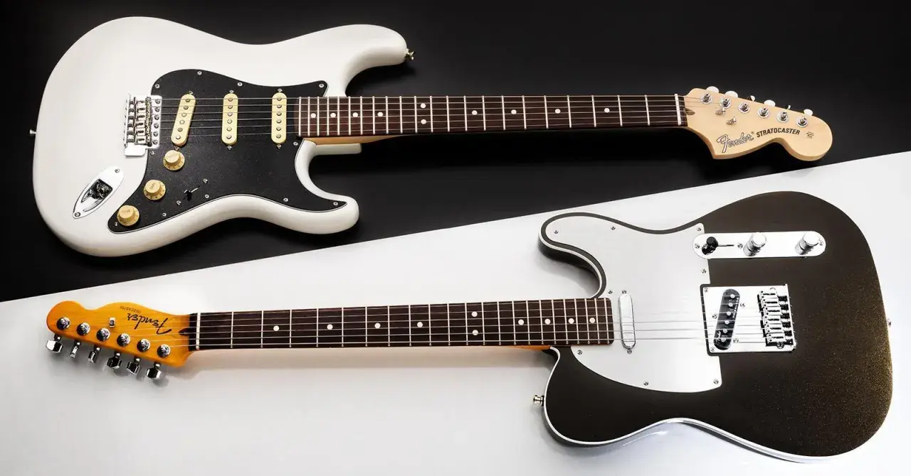 Stratocaster blanche et Telecaster noire, deux icônes Fender côte à côte. Le choix du guitariste entre ces deux légendes.