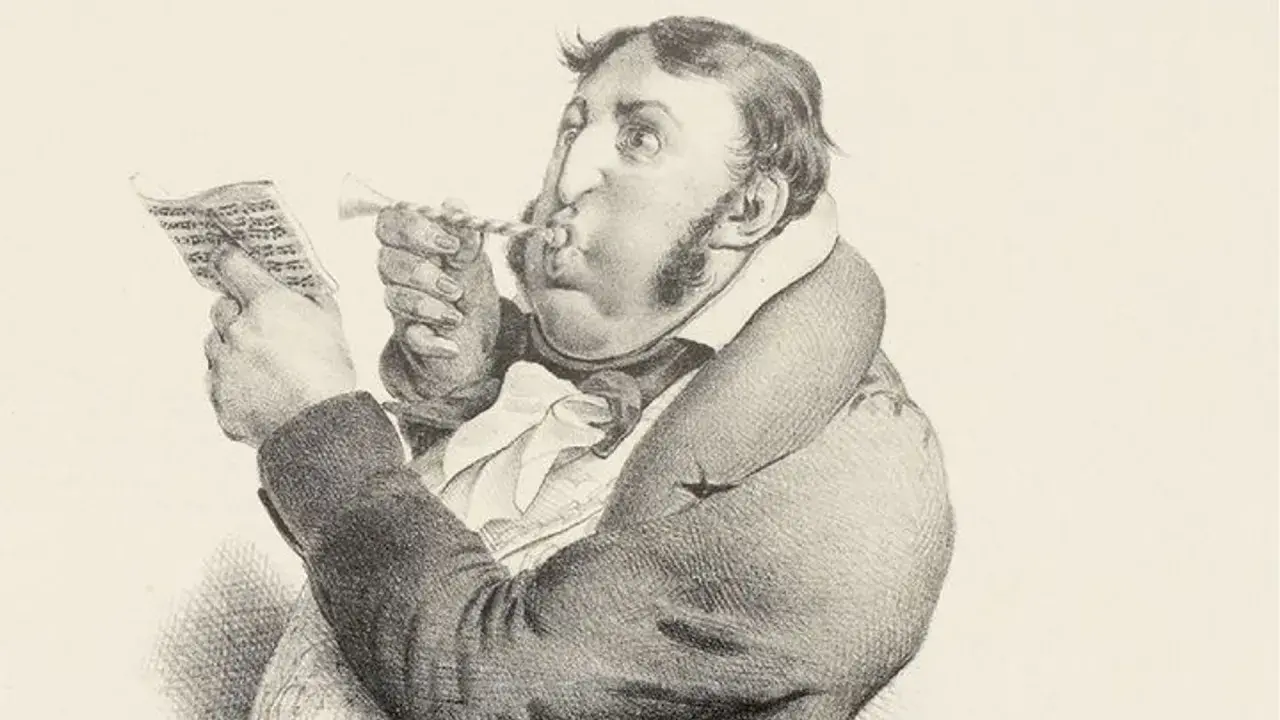 Un homme soufflant dans une trompette, lisant une partition. Un jargon, une définition de ce terme.