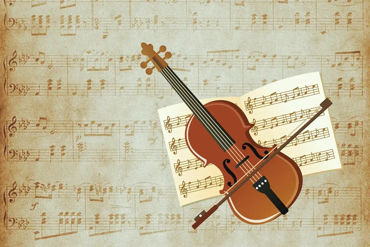 Violon et archet sur partition ancienne. Une invitation à découvrir comment on écrit musique, une partition qui raconte une histoire.